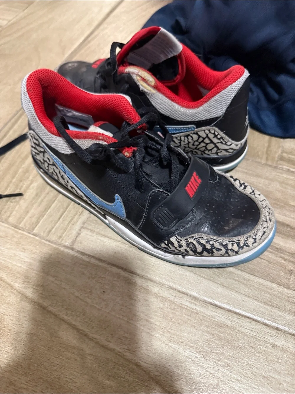 Nike Kids Black Sneakers with Red Lining and Blue Swoosh